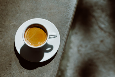 Cup of black coffee in a street cafe. flat lay. Place for text.の写真素材