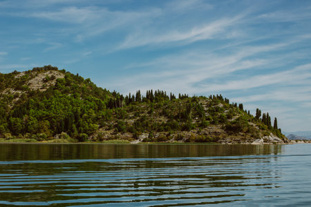 Amazing view of Skadar Lake and beautiful mountains on a sunny morning. Travel destination in Montenegro.の写真素材