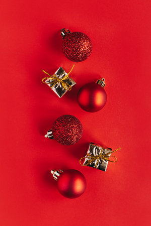 Beautiful Christmas ornaments with decorations on a bright red background. flat lay. Place for text.の写真素材
