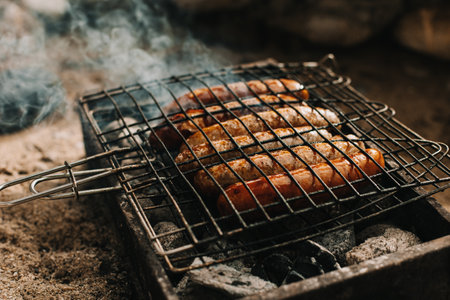 Delicious grilled sausage on a barbecue. Picnic menu. selective focus.の写真素材