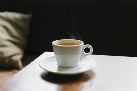 Cup of black coffee on a table in a cafe. selective focus. Place for text.