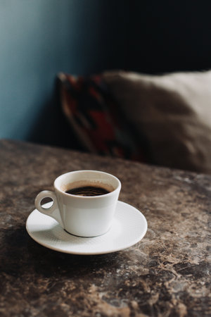 Cup of black coffee on a table in a cafe. selective focus. Place for text.の写真素材