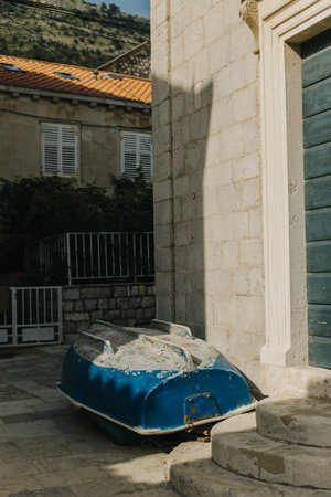 Old blue boat on the street of old Dubrovnik town. Minimal concept.の写真素材