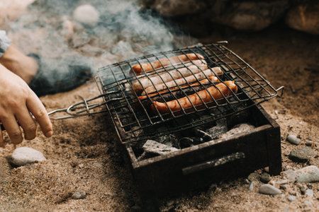 Delicious grilled sausage on a barbecue. Picnic menu. selective focus.の写真素材