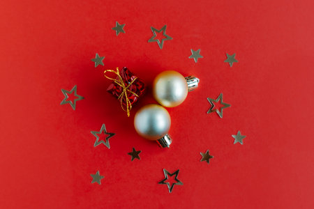 Beautiful Christmas ornaments on a bright red background. flat lay. Place for text.の写真素材