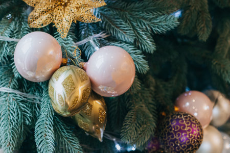 Spruce branches with Christmas ornaments and lights. Selective focus.の写真素材