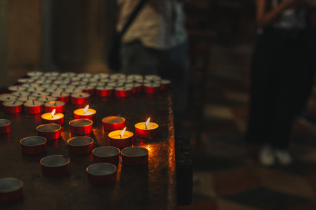 Burning candles in an old church. Selective focus.