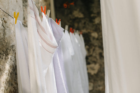 Freshly washed laundry hanging on the street in Dubrovnik old town, Croatia. Selective focus.の写真素材