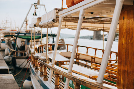 Fishing boats on a pier in Trogir old town, Croatia. Sunny summer day. Selective focus.
