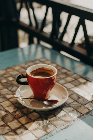 Cup of black coffee on a table in a street cafe.の写真素材