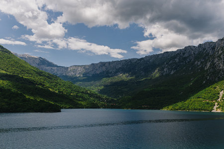 Amazing view of Piva Lake and beautiful canyon and mountains on a summer day. Travel destination in Montenegro.の写真素材