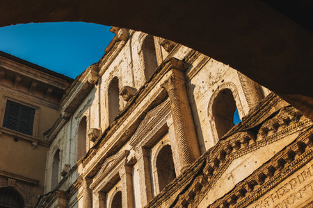 Old buildings on a street of Verona old town in a sunny day, Italy. Travel destination in Italy.の写真素材