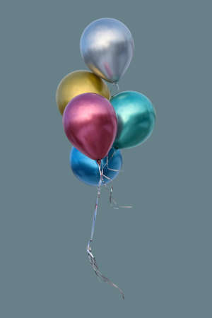 Balloons of different colors on a rope, on an isolated background.の写真素材