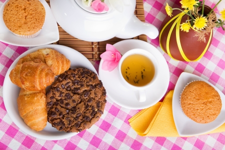 afternoon tea with croissants, cake and chocolate cookiesの写真素材