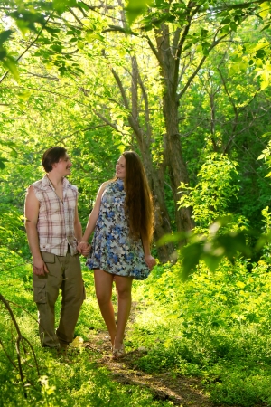two lovers walking in the summer forestの写真素材