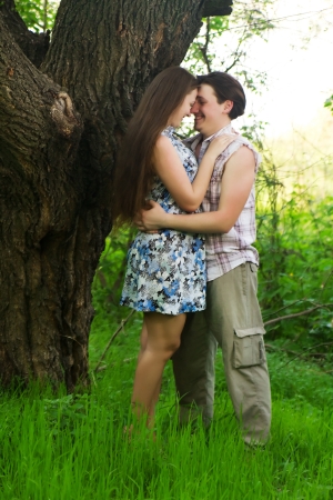 two Summer Lovers Embracing in a parkの写真素材