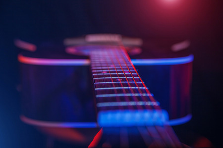acoustic Guitar on a bright background closeupの写真素材