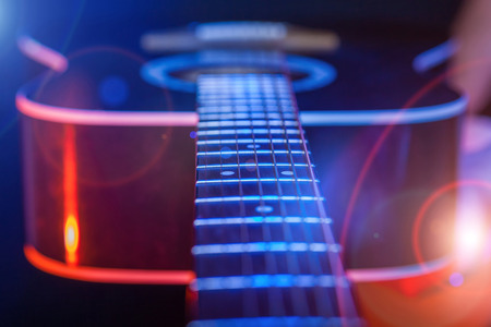 acoustic Guitar on a bright background closeupの写真素材