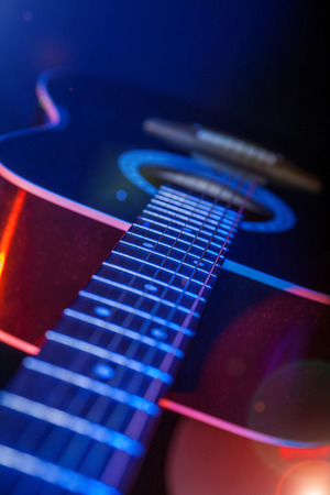 acoustic Guitar on a bright background closeupの写真素材