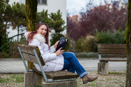 Woman with tablet outdoorの写真素材