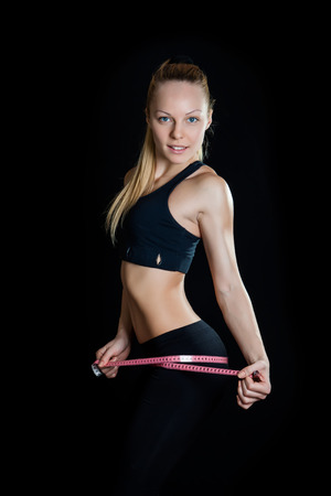 Perfect Body Prepared For Summer; Black Background And Pink Tape Measure.の写真素材