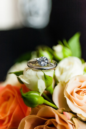 Two wedding gold rings close-up on the bridal bouquet.の写真素材