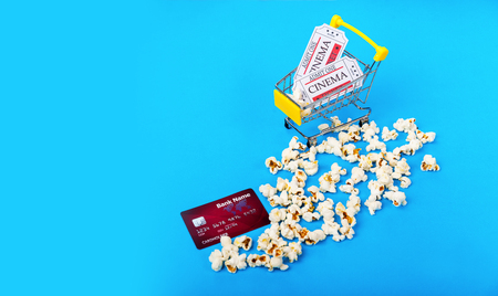 Small shopping cart with two tickets to cinema. Buy online with debet or credit card. Cinema concept.の写真素材