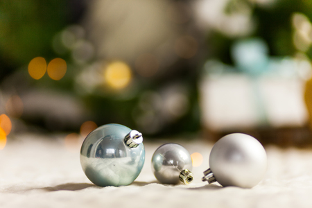 Pearl Grey Christmas balls close up on bokeh backgroundの写真素材