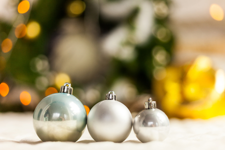 Pearl Grey Christmas balls close up on bokeh backgroundの写真素材