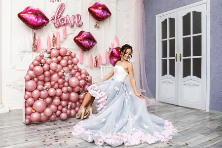 Wow omg. Emotion luxury romantic party Valentine's or Women's Day or Birthday event concept. Portrait of adorable lovely tender cute pretty charming girl in luxury dressの写真素材
