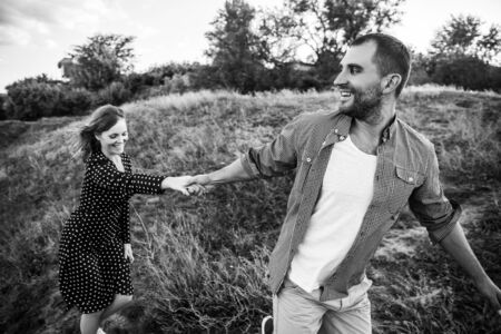 Love Couple in love romantic road summer field happy soft focus. Black and white stylized vintage...