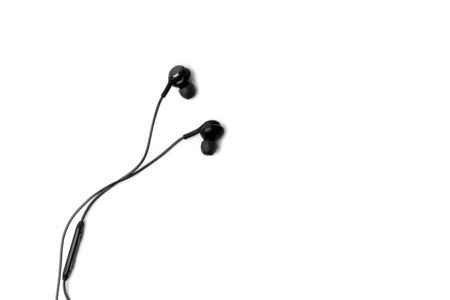 Black headphones for smartphone isolated white backgroundの写真素材