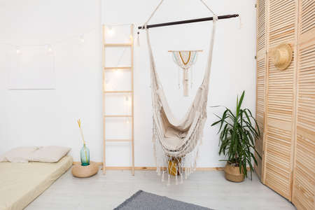 White interior room with bed and hammock, Blank white paper poster canvas Mock up template for...