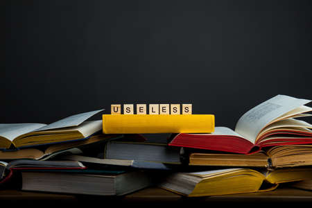 The concept of useless knowledge. Useless - word from wooden blocksの写真素材