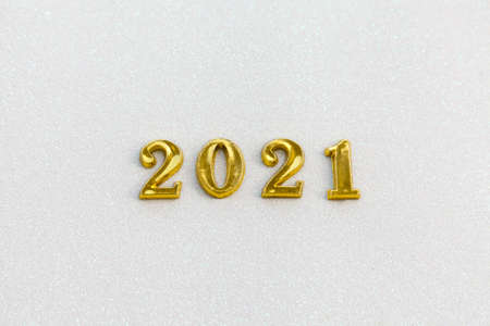 Happy New year 2021 celebration. Gold numeral 2021 on white sparkle background