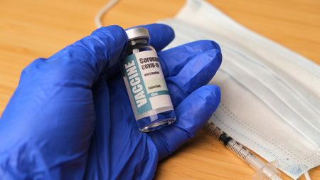 Doctor, nurse, scientist, researcher hand in blue gloves holding virus, vaccine disease preparing...