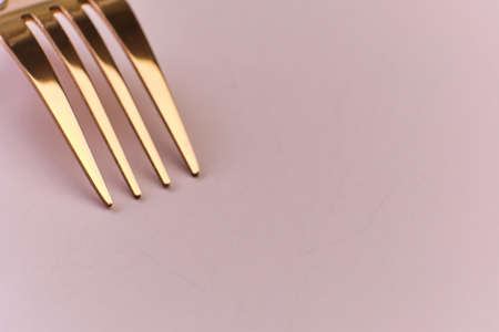 close up of rose metal fork on pink background with copy space. Selective focusの写真素材