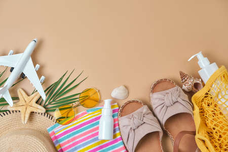 Beach wicker straw, women's eco bag, bright striped dress, sandals green tropical leaf on yellow...