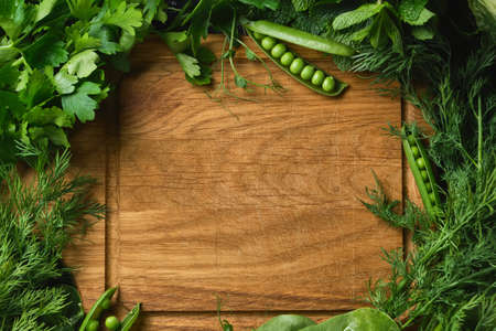 Close up Fresh raw vegetables ingredients for healthy cooking or salad and rustic wooden cutting...