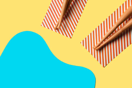 Creative minimal beach concept. Summer vacation layout with two doll legs on beach towels, flat...