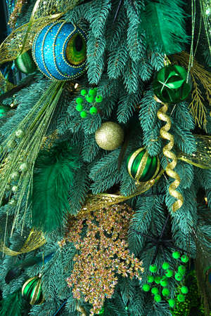 Stylish Christmas tree with light green, with peacock feathers in green and azure colors selective focusの写真素材