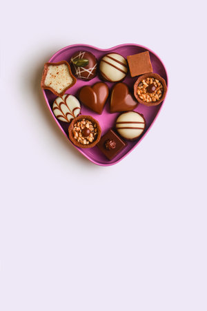 Closeup of an open heart shaped box of chocolates for Valentine's Day, mother's day, women's day on...