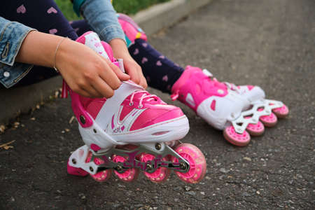 Close-up Of Legs Wearing Roller Skating Shoe, Outdoors