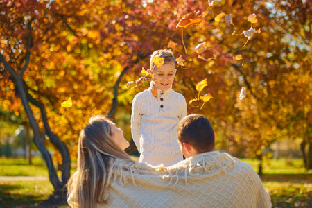 Young family, parents with their son are restingの写真素材