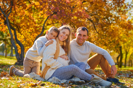 Young family, parents with their son are restingの写真素材