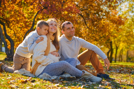 Young family, parents with their son are restingの写真素材