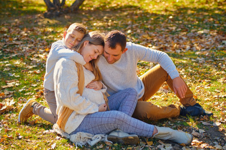 Young family, parents with their son are restingの写真素材