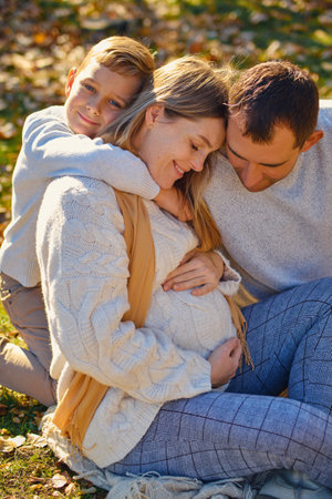 Young family, parents with their son are restingの写真素材