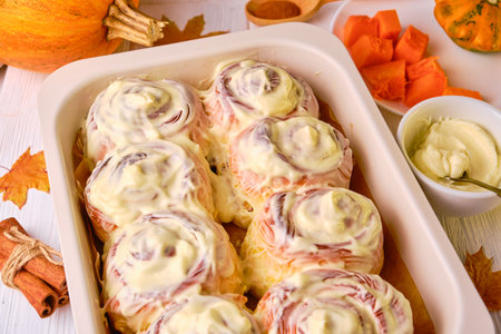 Homemade Pumpkin cinnamon rolls with cream cheeseの写真素材