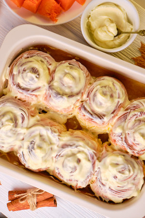 Homemade Pumpkin cinnamon rolls with cream cheeseの写真素材